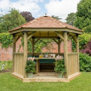 Forest Garden 3.6m Hexagonal Wooden Garden Gazebo with Cedar Roof - Furnished with Table, Benches and Cushions (Green)